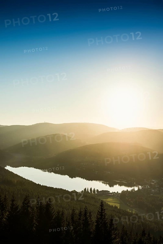 View from Hochfirst to Lake Titisee and Feldberg mountain at sunset