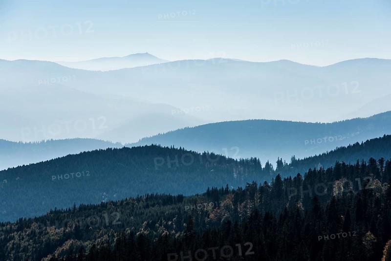 Staggered mountain ranges in the haze