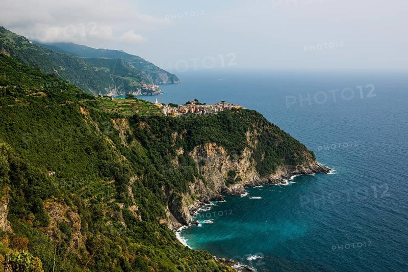 Mountain village with colourful houses on the coast