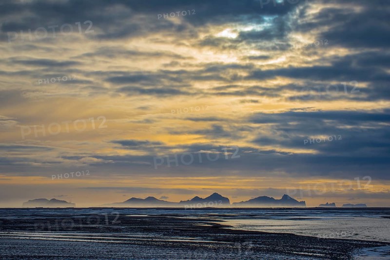 View from the mainland to the Westman Islands with cloudy sky