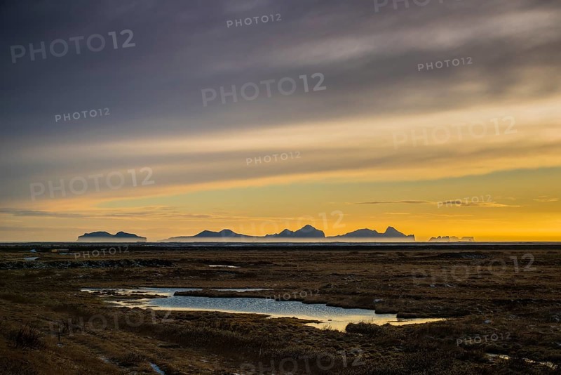 View from the mainland to the Westman Islands at sunset