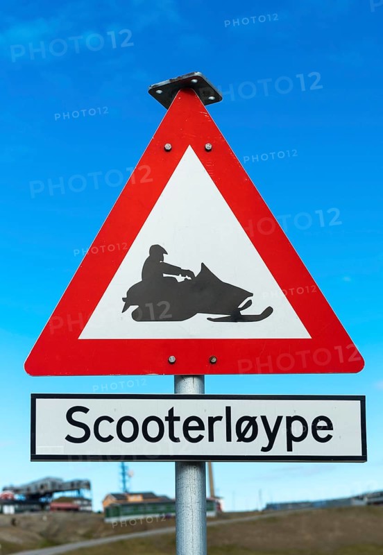Snow mobile warning road signpost