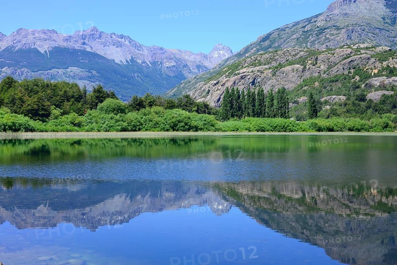 Mountain scenery reflected in the water of the Rio Futaleufu