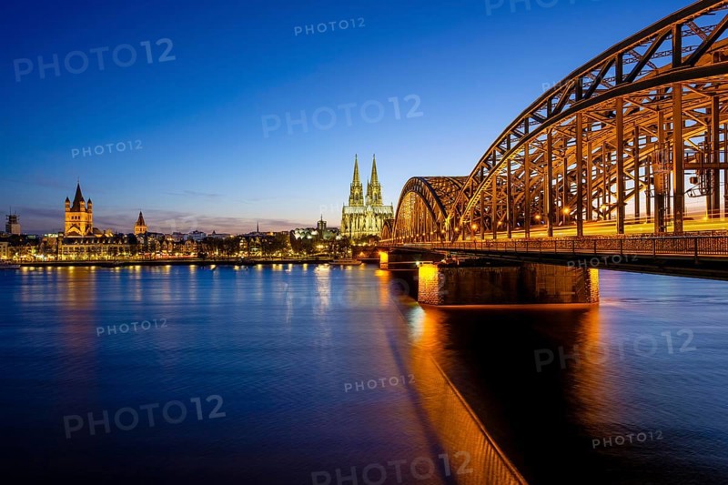 Church St Martins and Cologne Cathedral with Hohenzollern Bridge over the Rhine