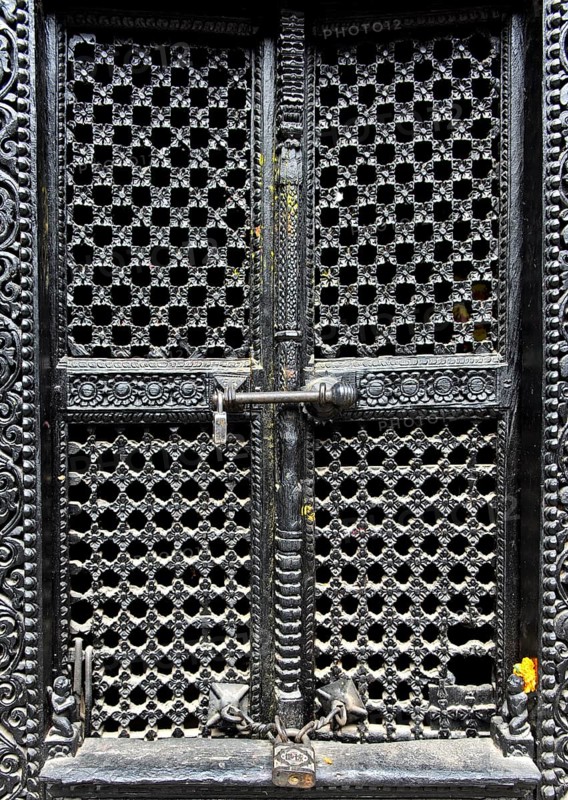 Artfully carved window grilles in traditional Newar style in Kumari Chowk inner courtyard