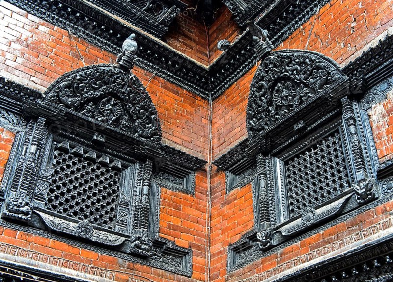 Artfully carved window grilles in traditional Newar style in Kumari Chowk inner courtyard
