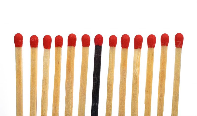 A black match among several bright matches