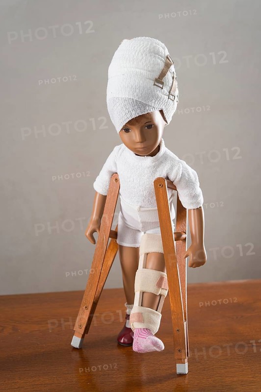Doll with bandaged head