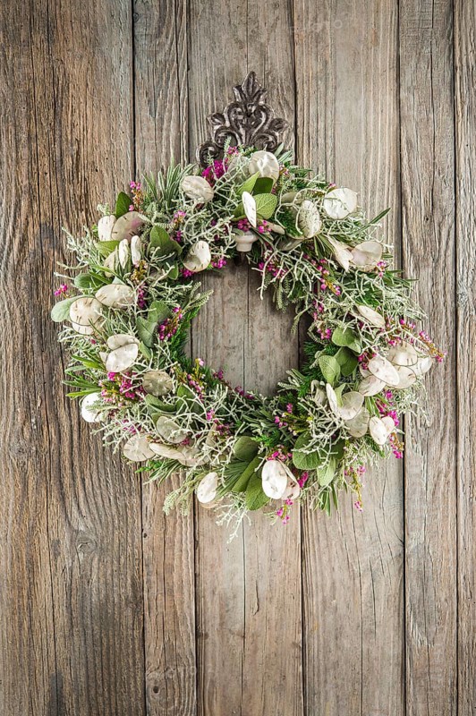 Autumn wreath on wooden wall