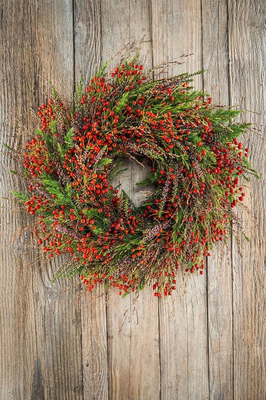 Autumn wreath on wooden wall