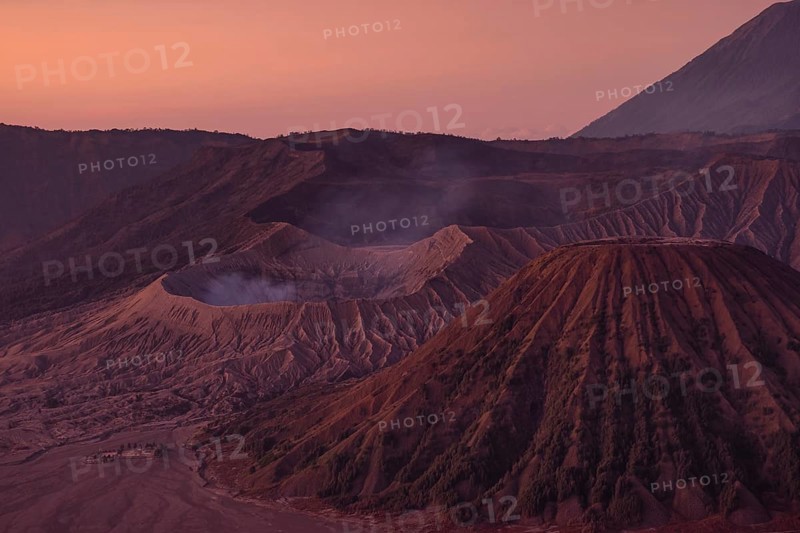Volcanic pipes with smoking volcano Gunung Bromo