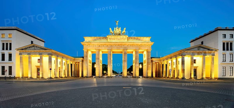 Pariser Platz with illuminated Brandenburg Gate at dawn
