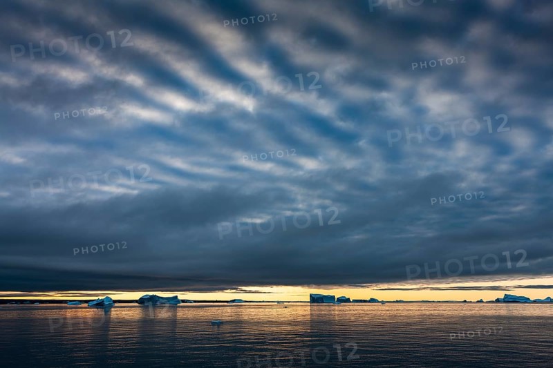 Icebergs at sunrise in the Arctic Sea