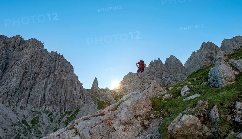 Hiker stands on a rock