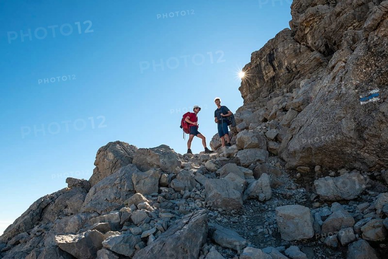 Two hikers ascending to the Hochvogel