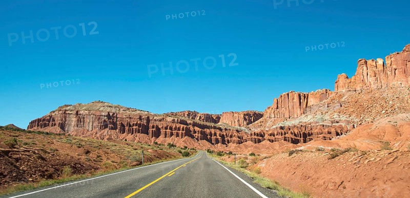 Red rugged sandstone cliffs on Highway 24
