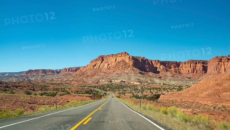 Red rugged sandstone cliffs on Highway 24