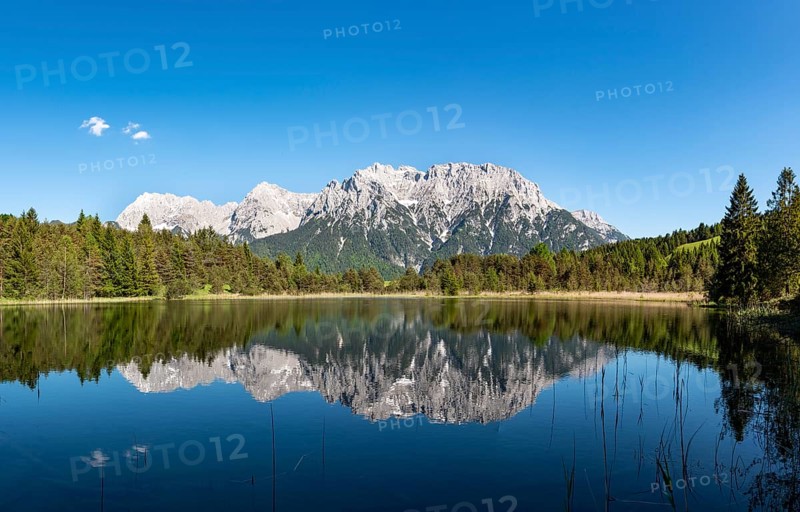 Western Karwendelspitze is reflected in Lake Luttensee