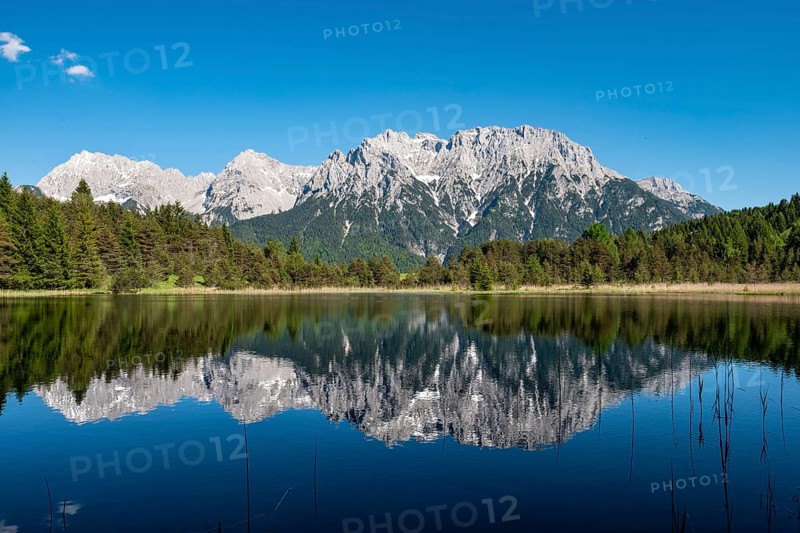 Western Karwendelspitze is reflected in Lake Luttensee