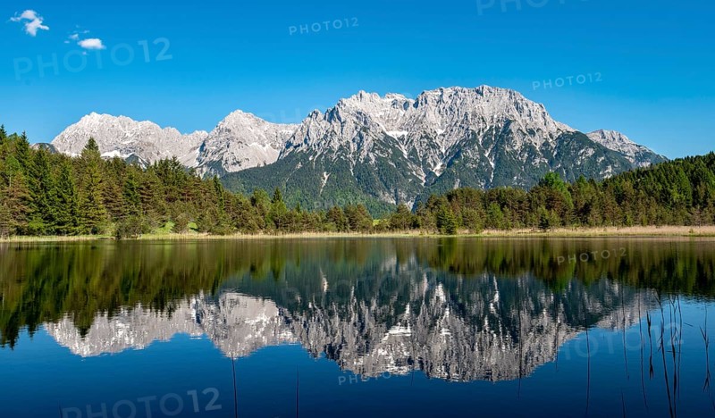 Western Karwendelspitze is reflected in Lake Luttensee