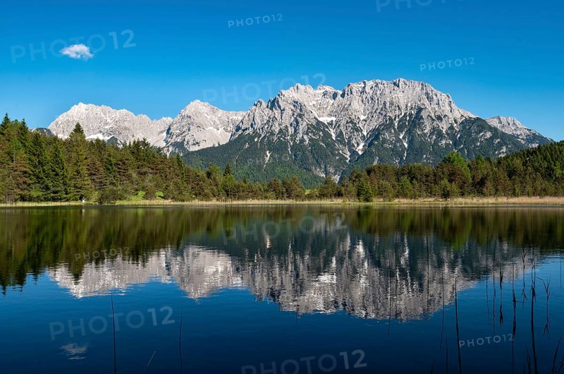 Western Karwendelspitze is reflected in Lake Luttensee