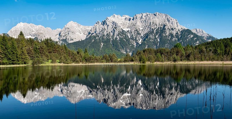 Western Karwendelspitze is reflected in Lake Luttensee