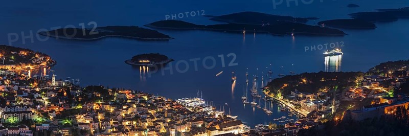Town view Hvar with harbour and Pakleni islands at night