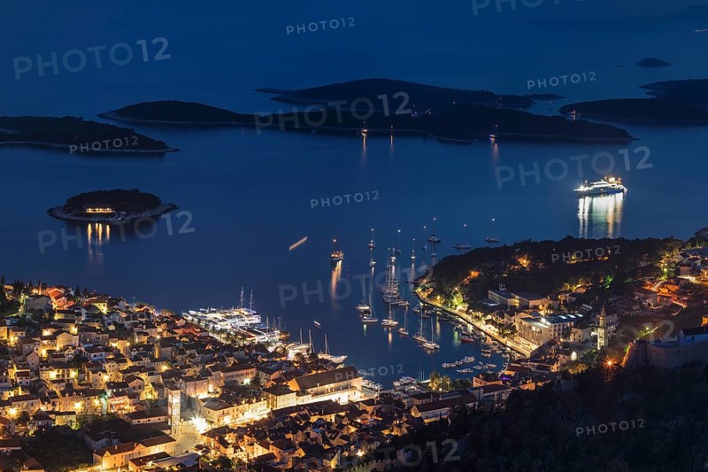 Town view Hvar with harbour and Pakleni islands at night