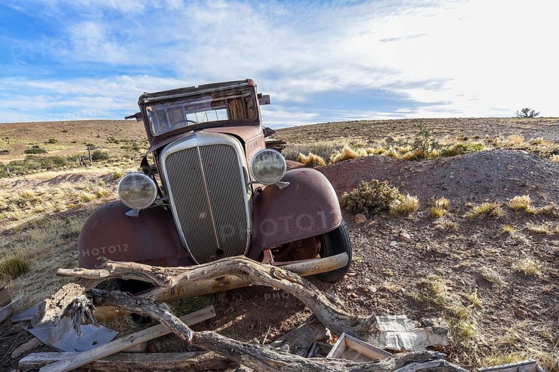 Pampa with old car on a farm in Bosques Petrificados de Jaramillo National Park