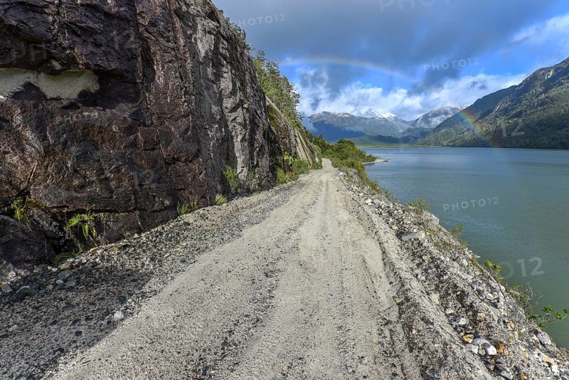 Gravel road with rainbow near Puerto Rio Tranquilo