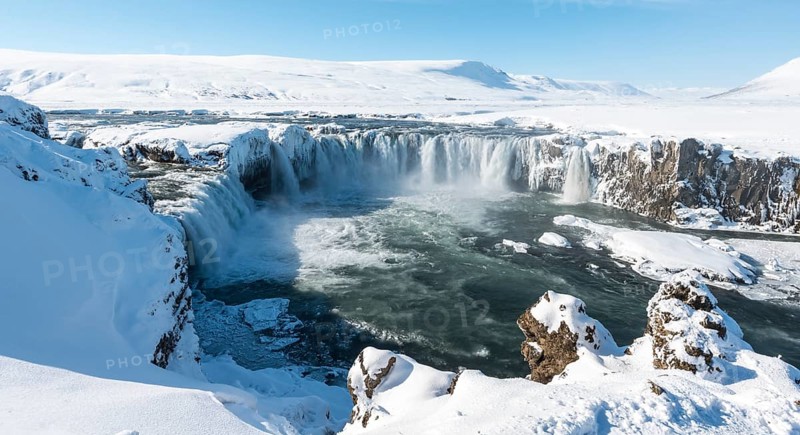 Gooafoss Waterfall in winter with snow and ice