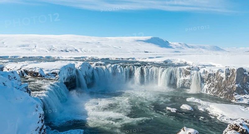 Gooafoss Waterfall in winter with snow and ice