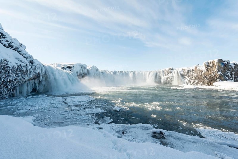 Gooafoss Waterfall in winter with snow and ice