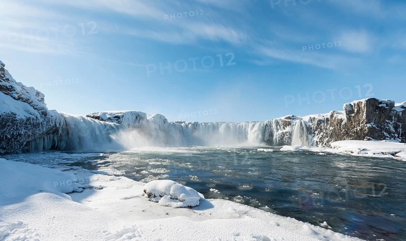 Gooafoss Waterfall in winter with snow and ice