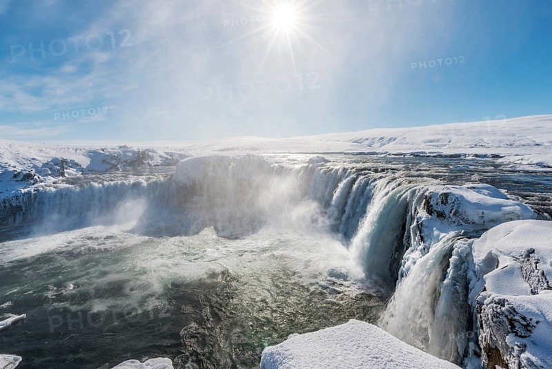 Gooafoss Waterfall in winter with snow and ice