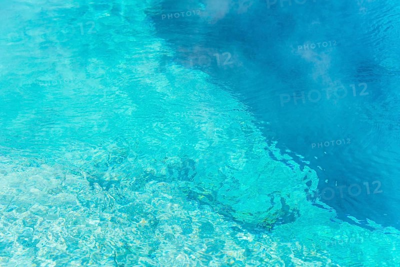 Turquoise clear water of a hot spring