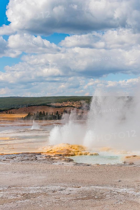 Steaming geyser with water fountain
