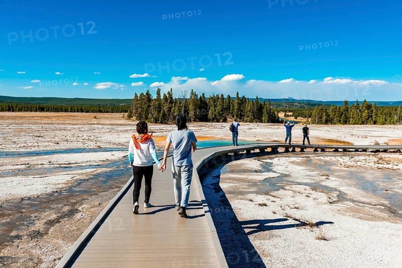 Two tourists on a jetty in the thermal area