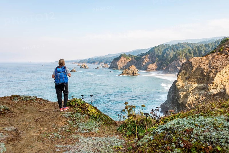 Young woman looking out to sea