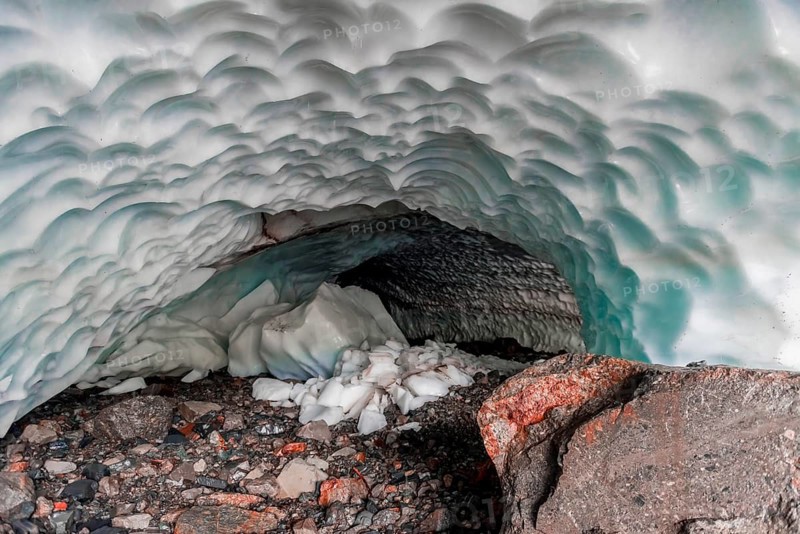 Entrance of an ice cave of a glacier
