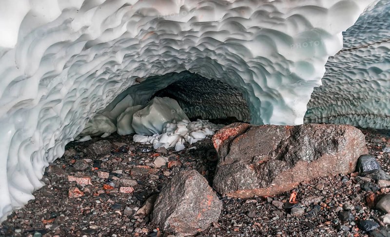 Entrance of an ice cave of a glacier