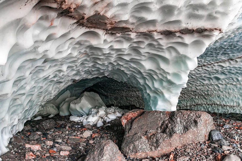 Entrance of an ice cave of a glacier