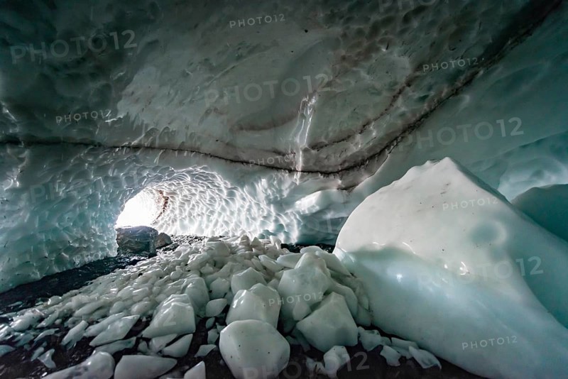 Entrance of an ice cave of a glacier