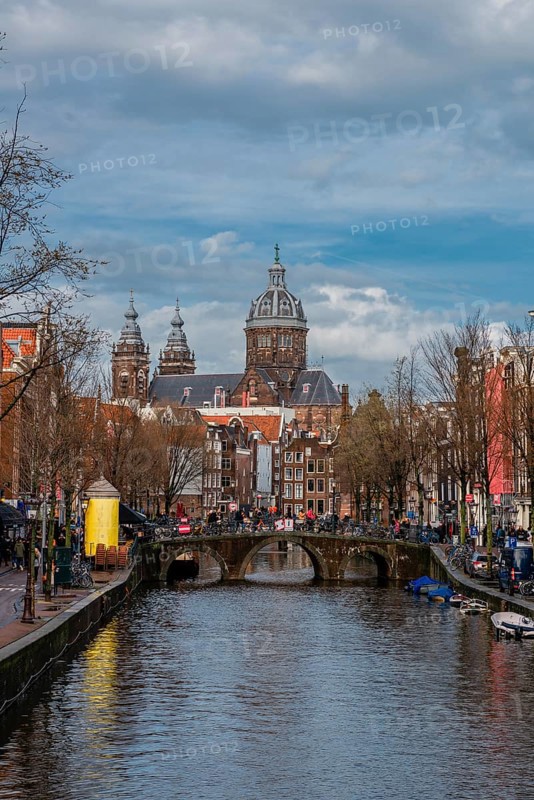 View from a bridge at Oudezijds Voorburgwal to the canal and the Sint Nicolaaskerk