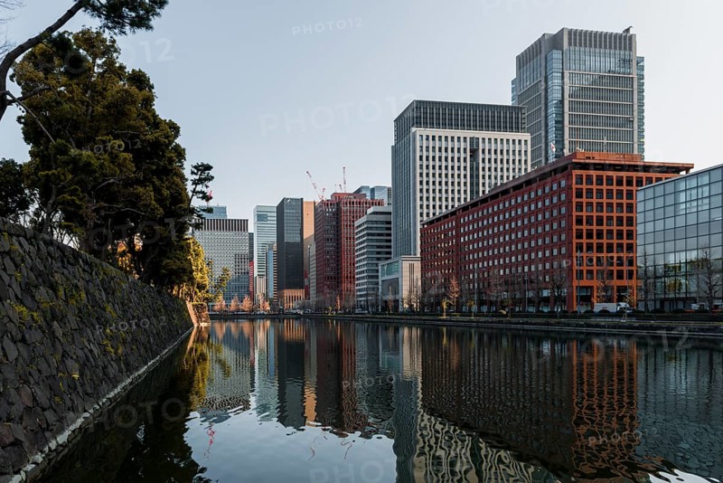 High-rise buildings reflected in a canal