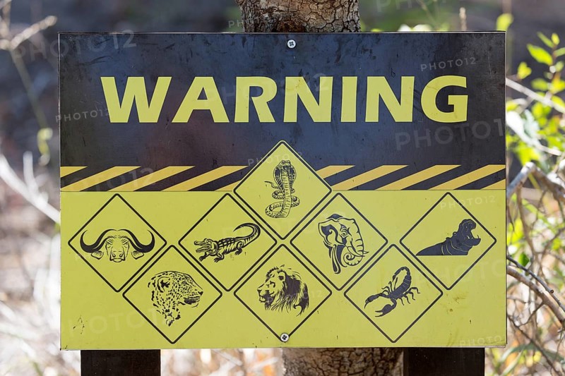 Warning sign displaying dangerous animals