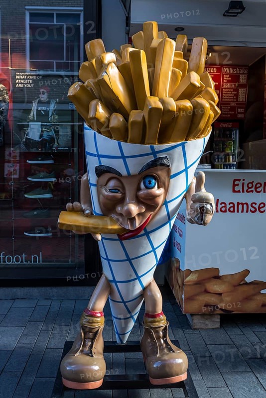 French fries figure in front of a snack bar