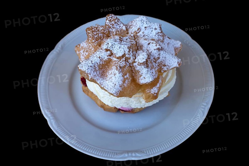 Cream puff on a white plate