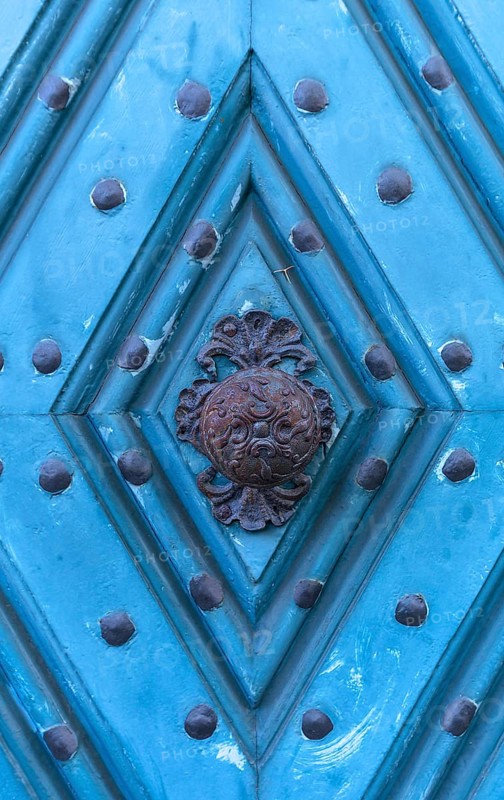 Historical doorknob on a blue front door