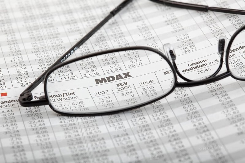 Reading glasses lying on newspaper